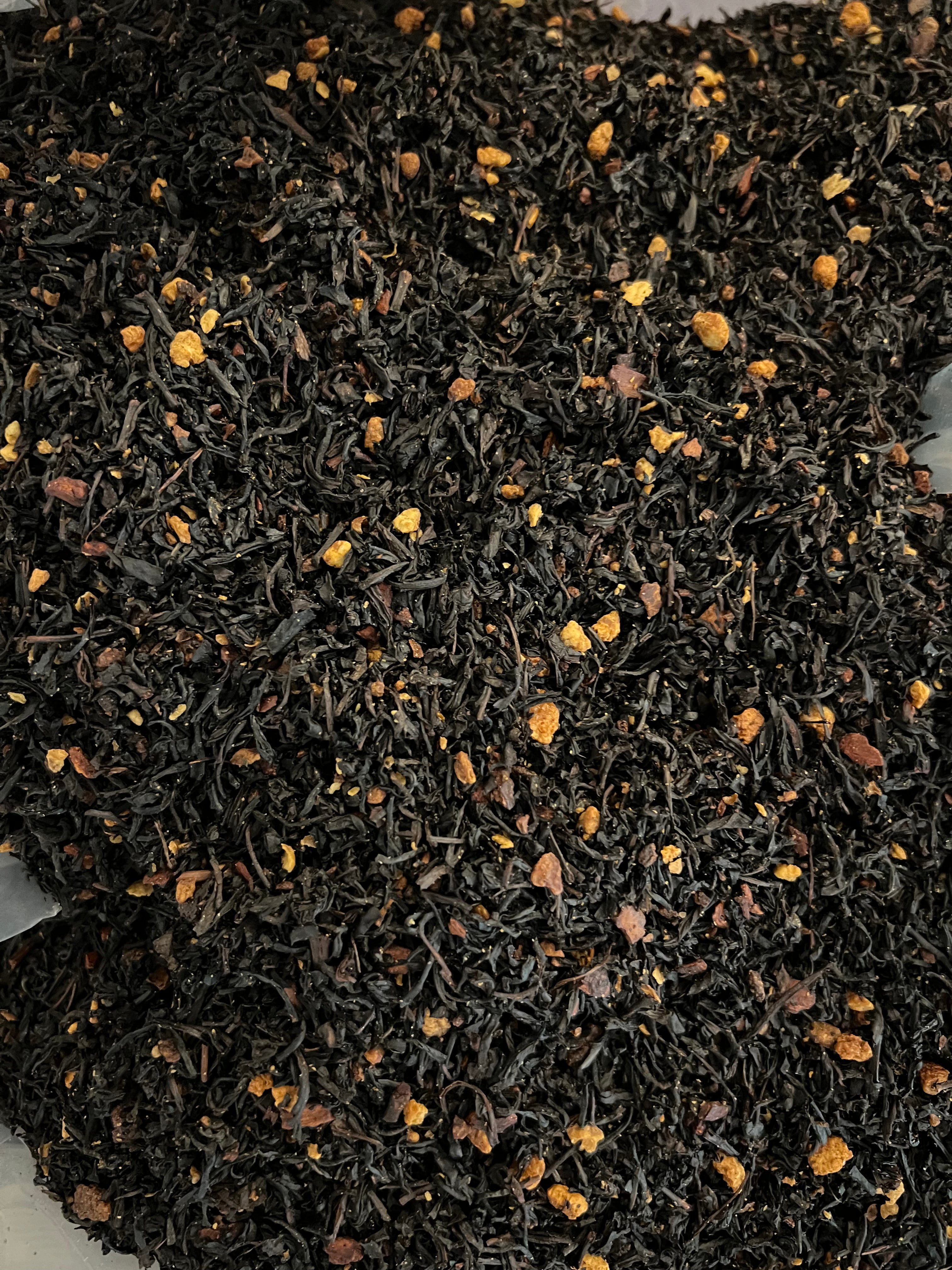 Close-up of Cinnamon Blaze Betty tea leaves with Keemun and Assam black tea, cinnamon, and cloves. Legendary Aviation Coffee in Rockwall Texas