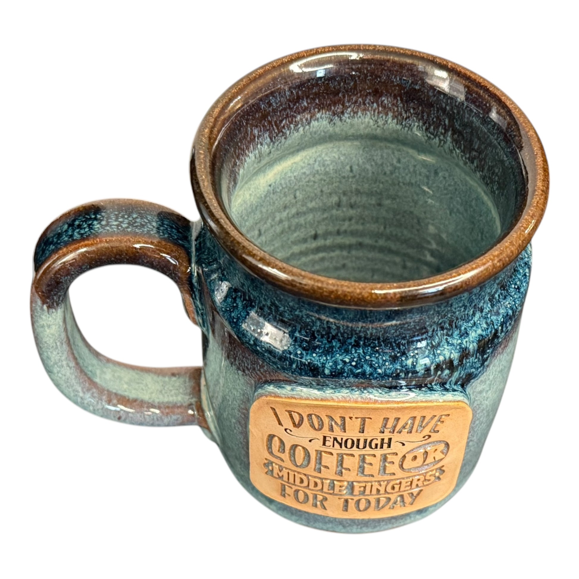 Top view of the Middle Finger Mug, highlighting its 20oz capacity and unique, handcrafted glaze by Sunset Hill Stoneware, sold by Legendary Aviation Coffee.