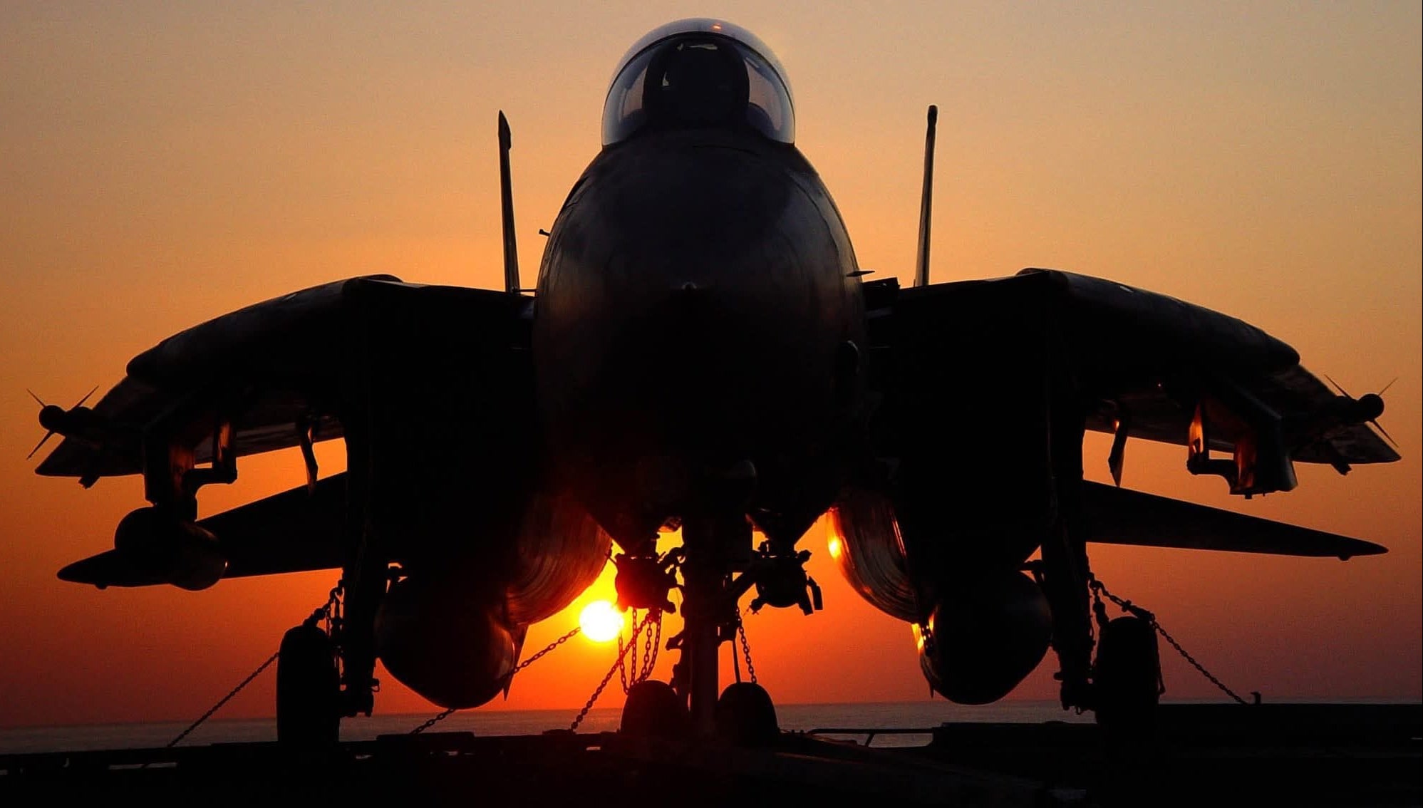 Legendary Aviation Coffee, Rockwall Texas, Silhouette of a fighter jet against a sunset sky