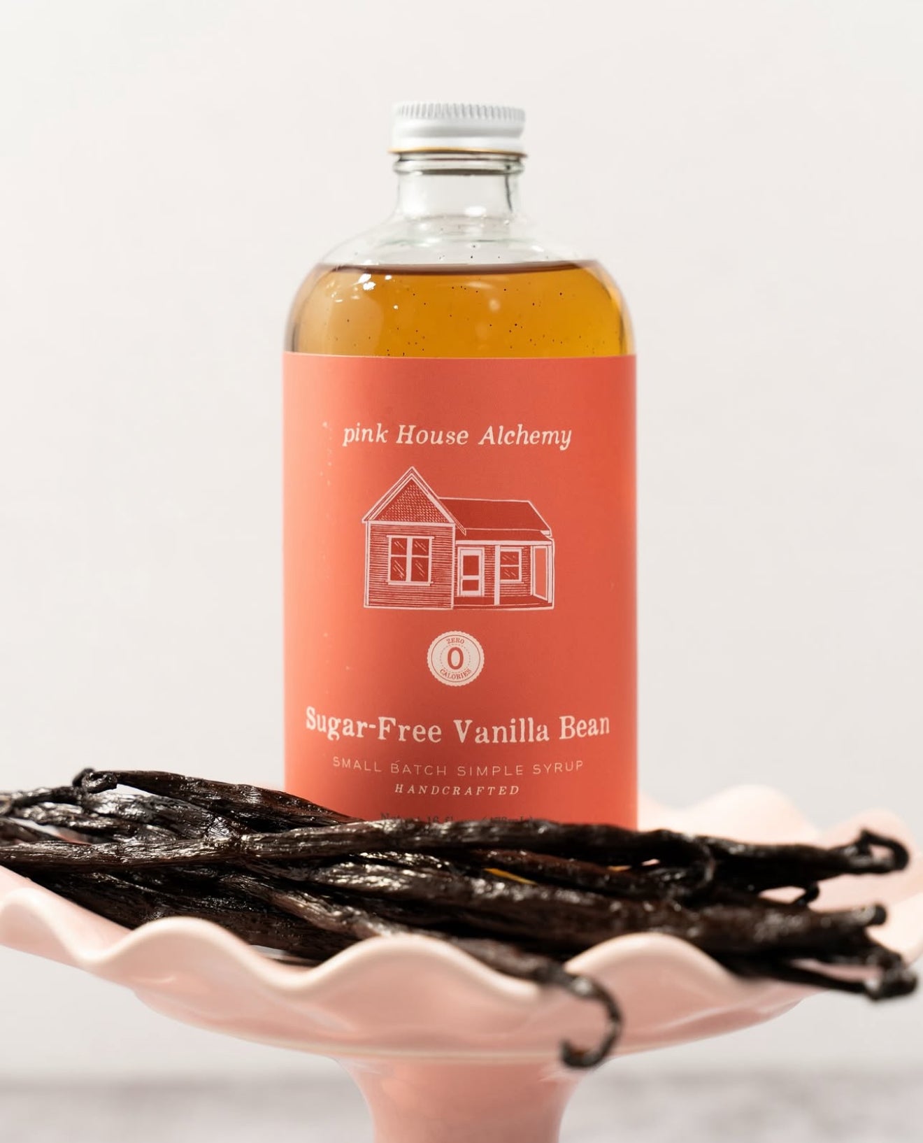 Pink House Alchemy Sugar-Free Vanilla Bean Syrup on display at Legendary Aviation Coffee Company in Rockwall, Texas – keto-friendly vanilla syrup perfect for specialty coffee, cold brew, and handcrafted drinks
